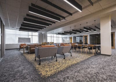 Open lounge area at the Fort Wayne Campus with couches, tables, and chairs