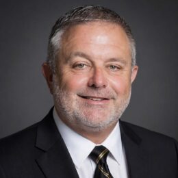 Portrait image of Rick in a tie and suitcoat.