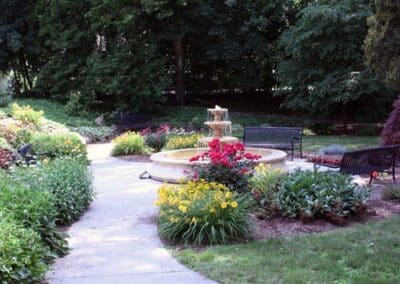 Muir Peace Garden with a fountain, flowers, shrubs, and benches