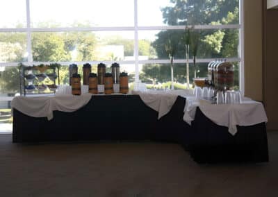 Coffee, tea, and other beverages set up at a table for an event